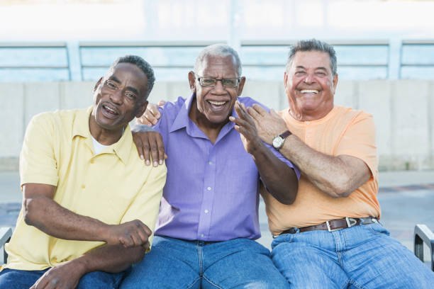 istock Three multi-ethnic senior men on bench outdoors 642628604