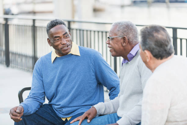 istock Three multi-ethnic senior men on bench outdoors 642628790