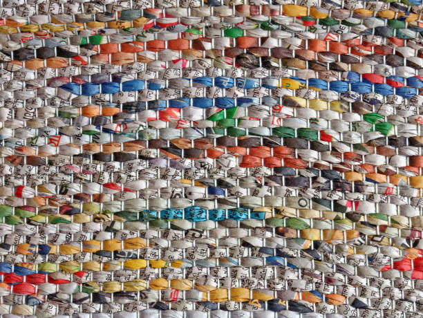 istock upccling - rolled up newspaper pages woven 642628996
