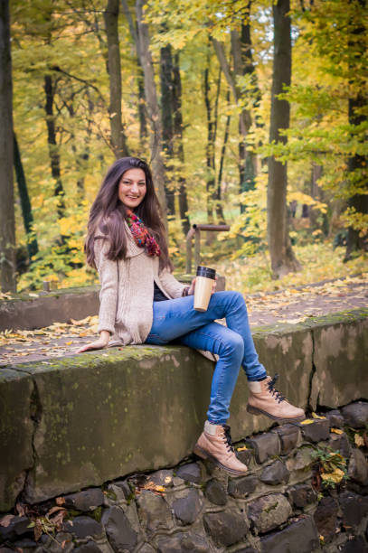 istock girl sitting on the stone 642634294