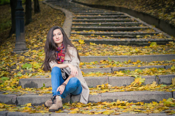 istock girl sitting on stone steps 642634916