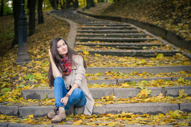 istock girl sitting on stone steps 642634936
