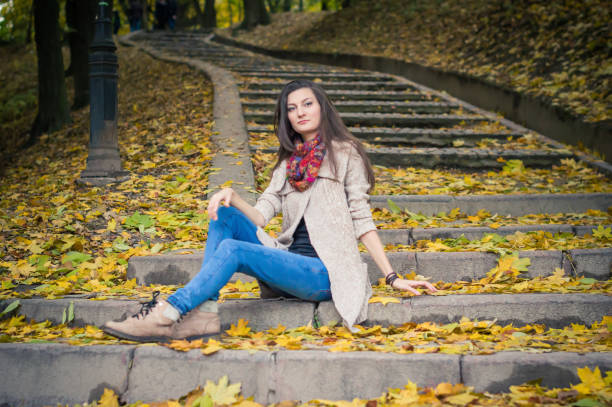 istock girl sitting on stone steps 642634988