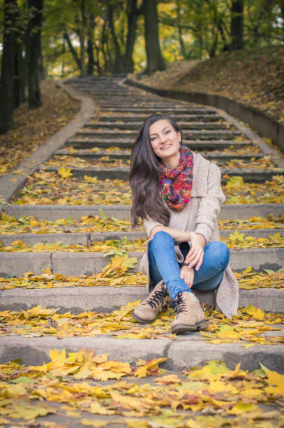 istock girl sitting on stone steps 642635028