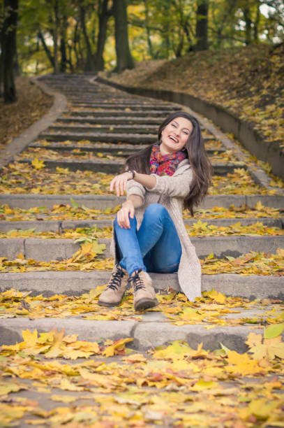 istock girl sitting on stone steps 642635074
