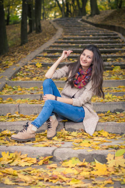 istock girl sitting on stone steps 642635126