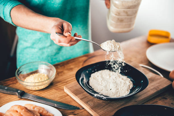 istock Woman Pouring breadcrumbs 642650084