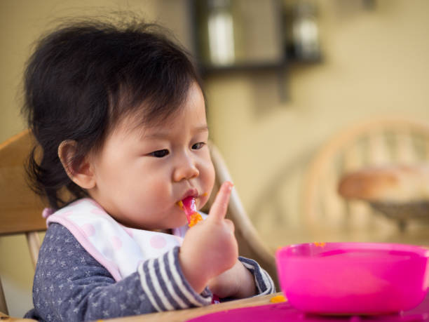 istock eating mess baby girl 642652946