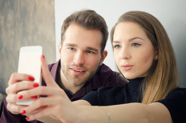istock Young couple taking a selfie photo 642656366