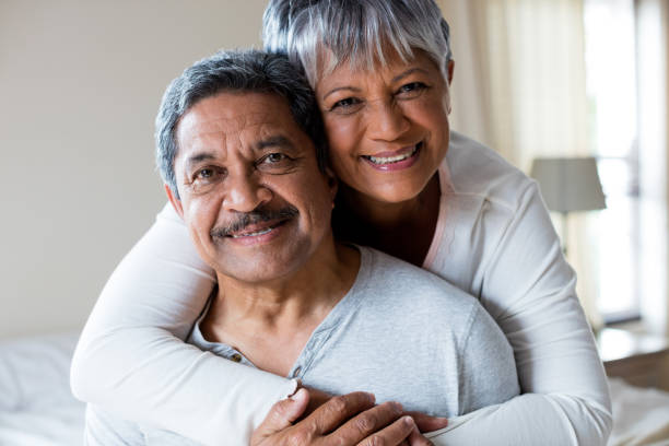 istock Romantic couple embracing in bedroom 642658414