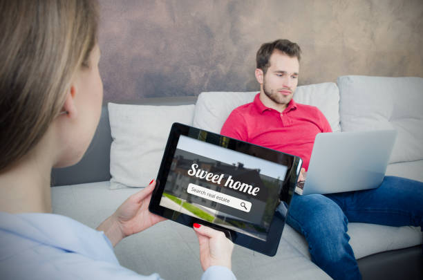 istock Young couple looking on the internet your own home 642658432