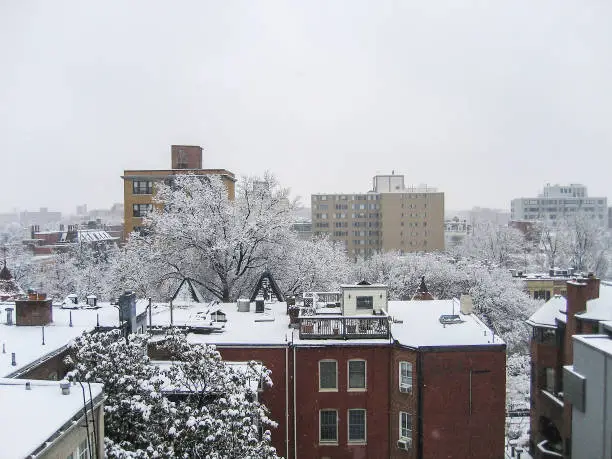 Cityscape or skyline of Washington DC Dupont Circle apartment buildings in winter snow