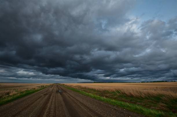 istock Rural road and rain storm 642665238