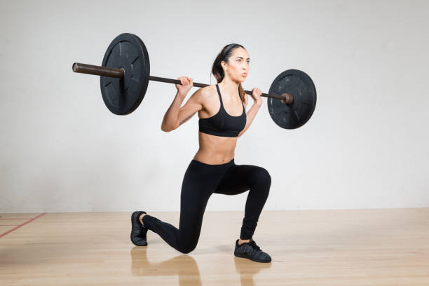 istock Women Lifting A Barbell 642665972
