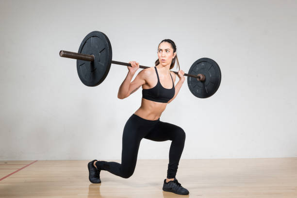 istock Women Lifting A Barbell 642666388
