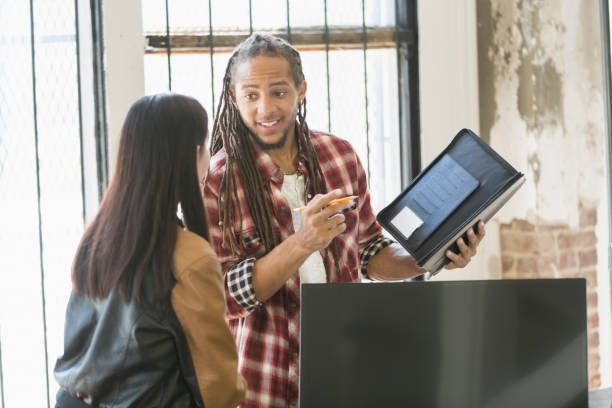 istock Young man with dreadlocks and woman, business startup 642674148