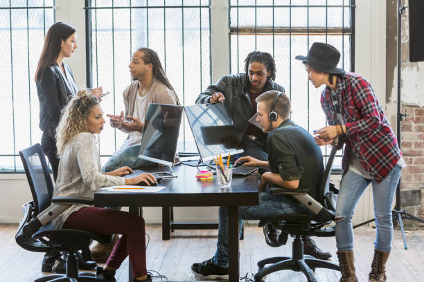 istock Multi-ethnic young creatives in a business meeting 642676204