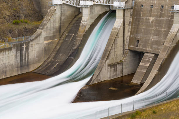 istock Water converging from hydro dam spillways 642694120