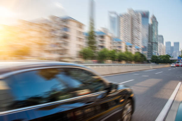 istock urban traffic with cityscape 642699450