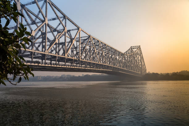 istock Historic Howrah bridge on river Hooghly at sunrise. 642704940