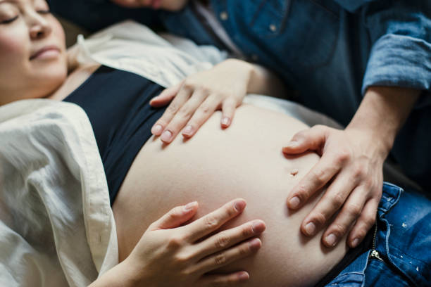 istock Pregnant mother with her husband on bed 642709140