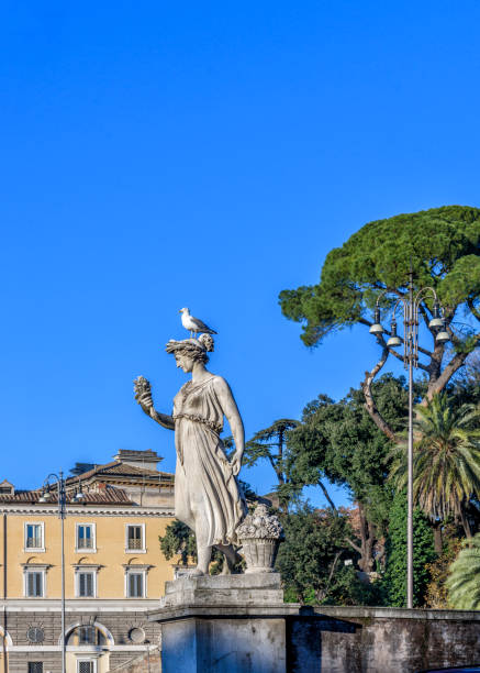 istock Statue in Piazza del Popolo in Rome with a seagull on the head 642709462
