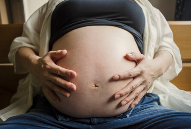 istock Pregnant mother and husband taking a selfie 642712652