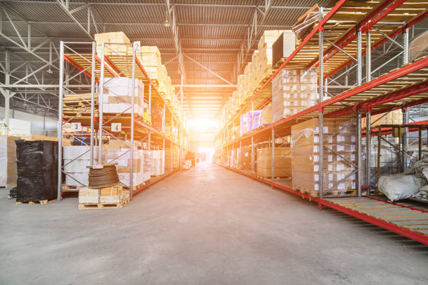 istock Long shelves with a variety of boxes and containers. 642715192