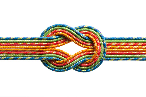 Knot with eight ropes of different colors.  The ropes are red, blue, yellow and green in color.