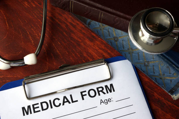 istock Medical form on a table and stethoscope. 642718446