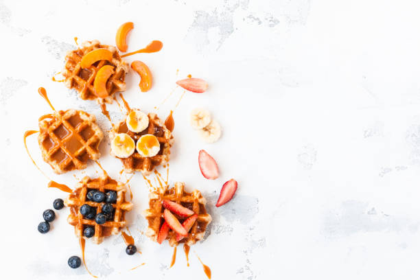 istock Traditional belgian waffles with fresh fruit and caramel 642727316