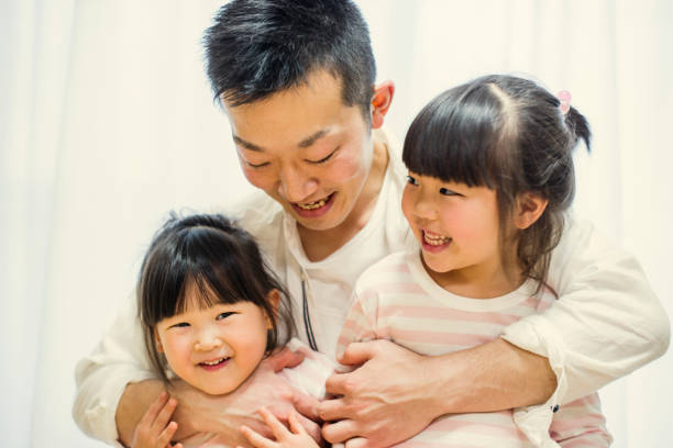 istock Father with two sisters at home. 642751434