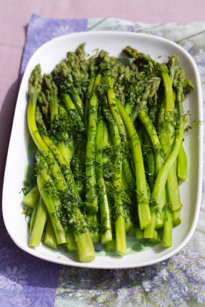 istock green asparaguses with the fresh dill 642769436