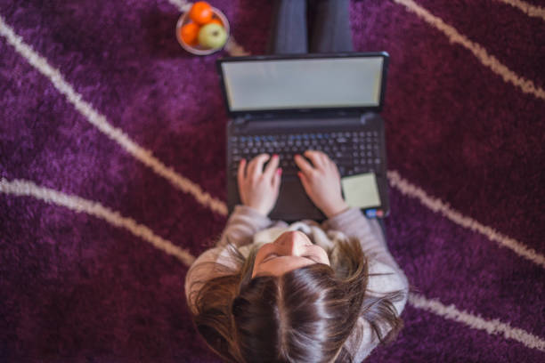 istock Woman typing on laptop at home. 642778278