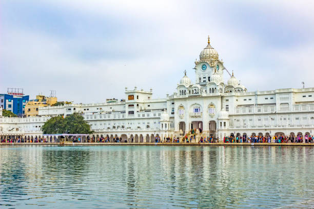 istock people visit the Harimandir Sahib at the Golden temple complex 642794438