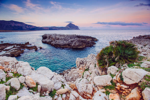 Sea coast at sunset Cape Milazzo. Italy.