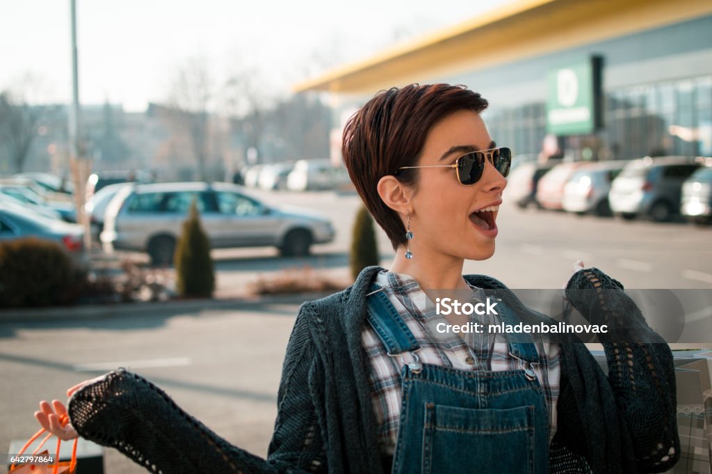 Happy young woman with shopping bags Adult Stock Photo