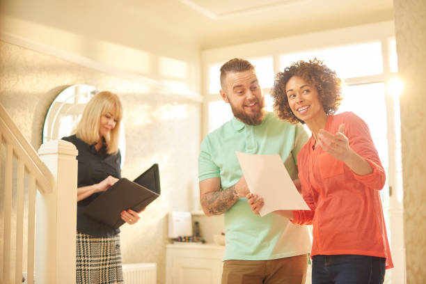 istock excited couple viewing a potential home 642799820