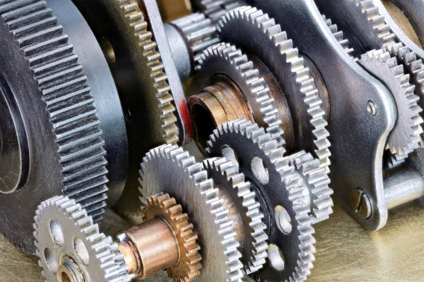 istock various gear cogwheels on scratched metal industrial background closeup 642803442