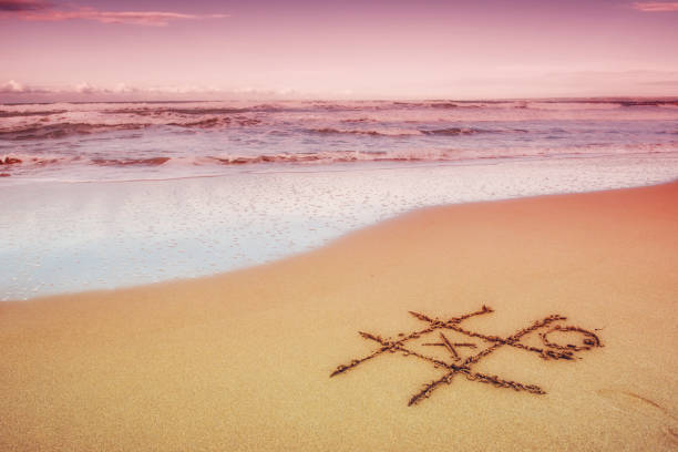 istock Figures in the sand on the beach 642806612