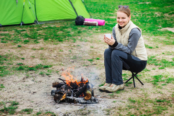 istock Woman warm up near the fire 642809138