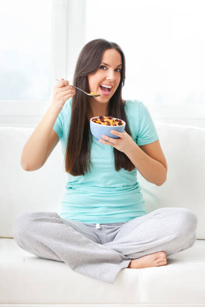 istock Young girl eating breakfast 642813094