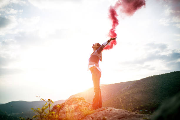 istock Woman holding flaming torch 642819300