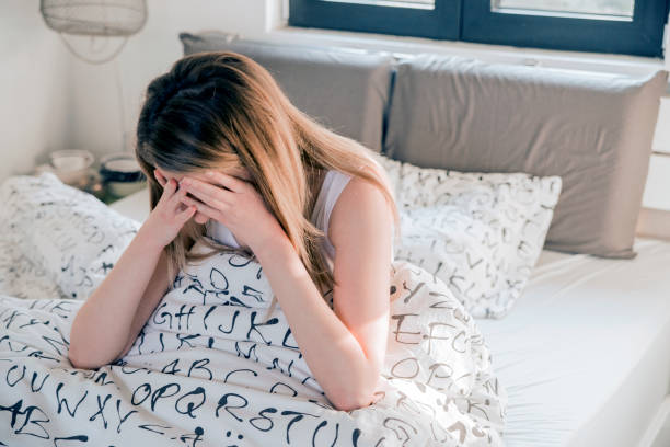 istock Tormented young woman in her bedroom 642819572