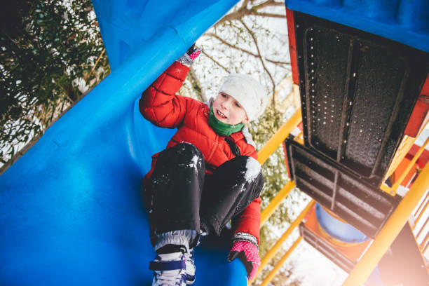 istock Little girl on slide 642821976