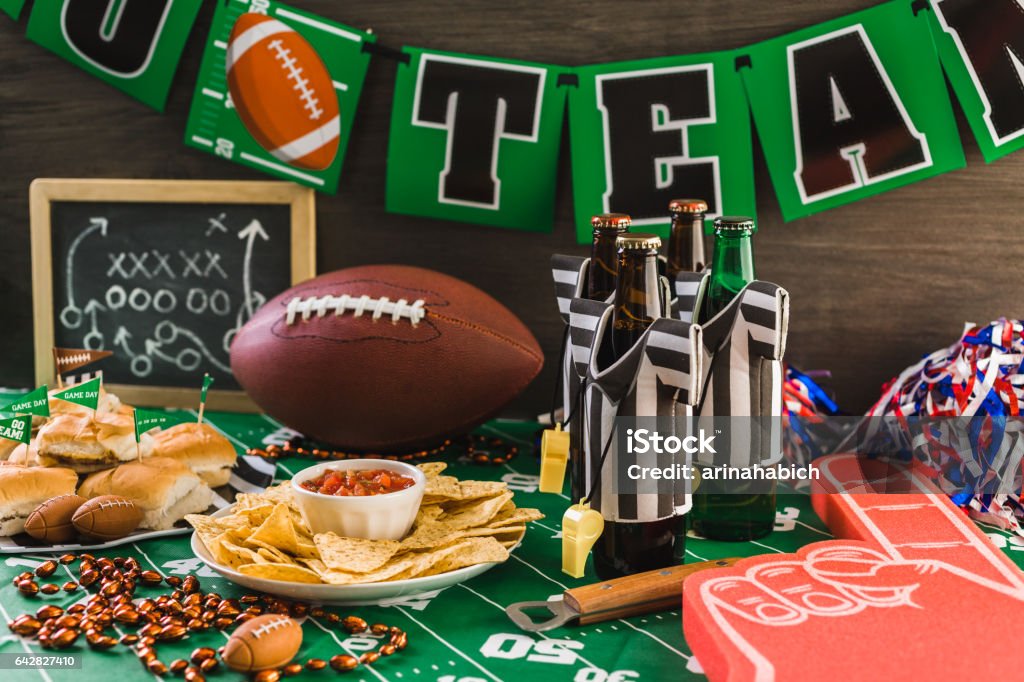 chips and salsa Game day football party table with beer, chips and salsa. American Football - Sport Stock Photo