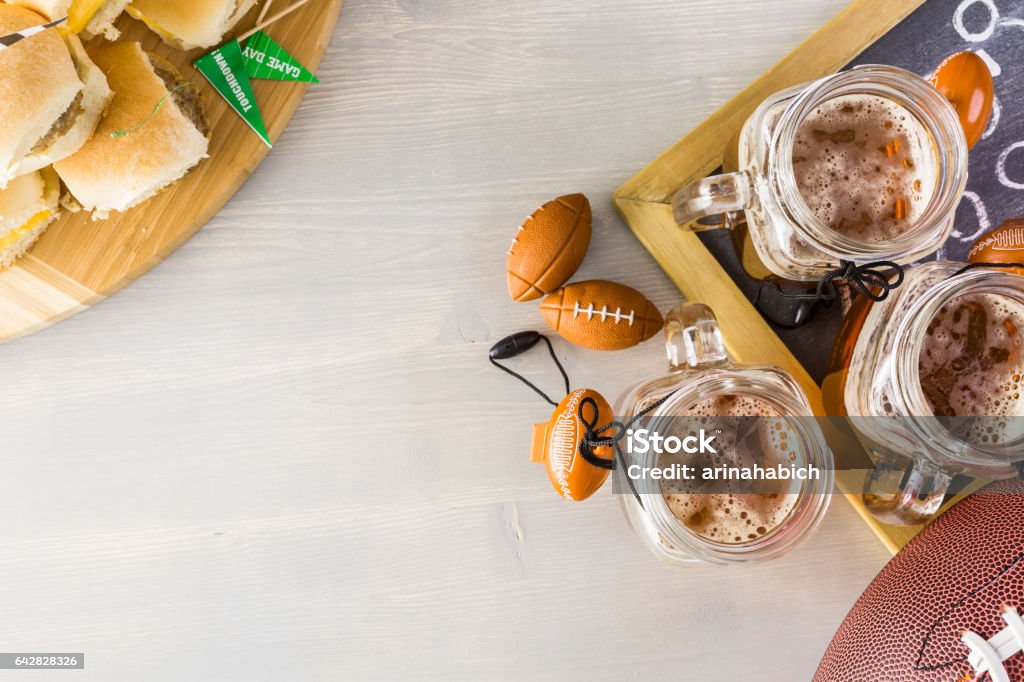 Sliders with veggie tray Sliders with veggie tray on the table for the football party. American Football - Sport Stock Photo