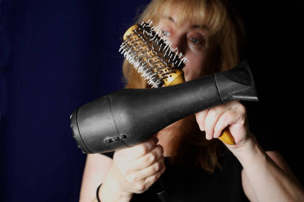 istock Woman With Hairdryer 642840732