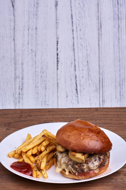 istock Dish with burger and french fries 642841782