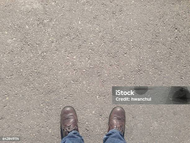 Man Standing On The Street Stock Photo - Download Image Now - Sidewalk, Foot, Directly Above
